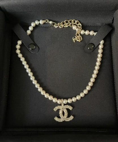 New pearl and diamond logo necklace