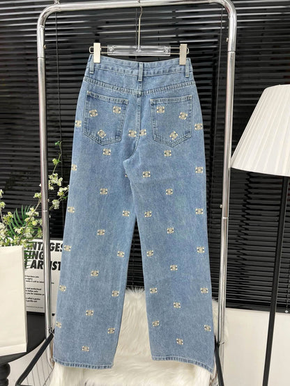 Denim trousers with all-over logo embroidery